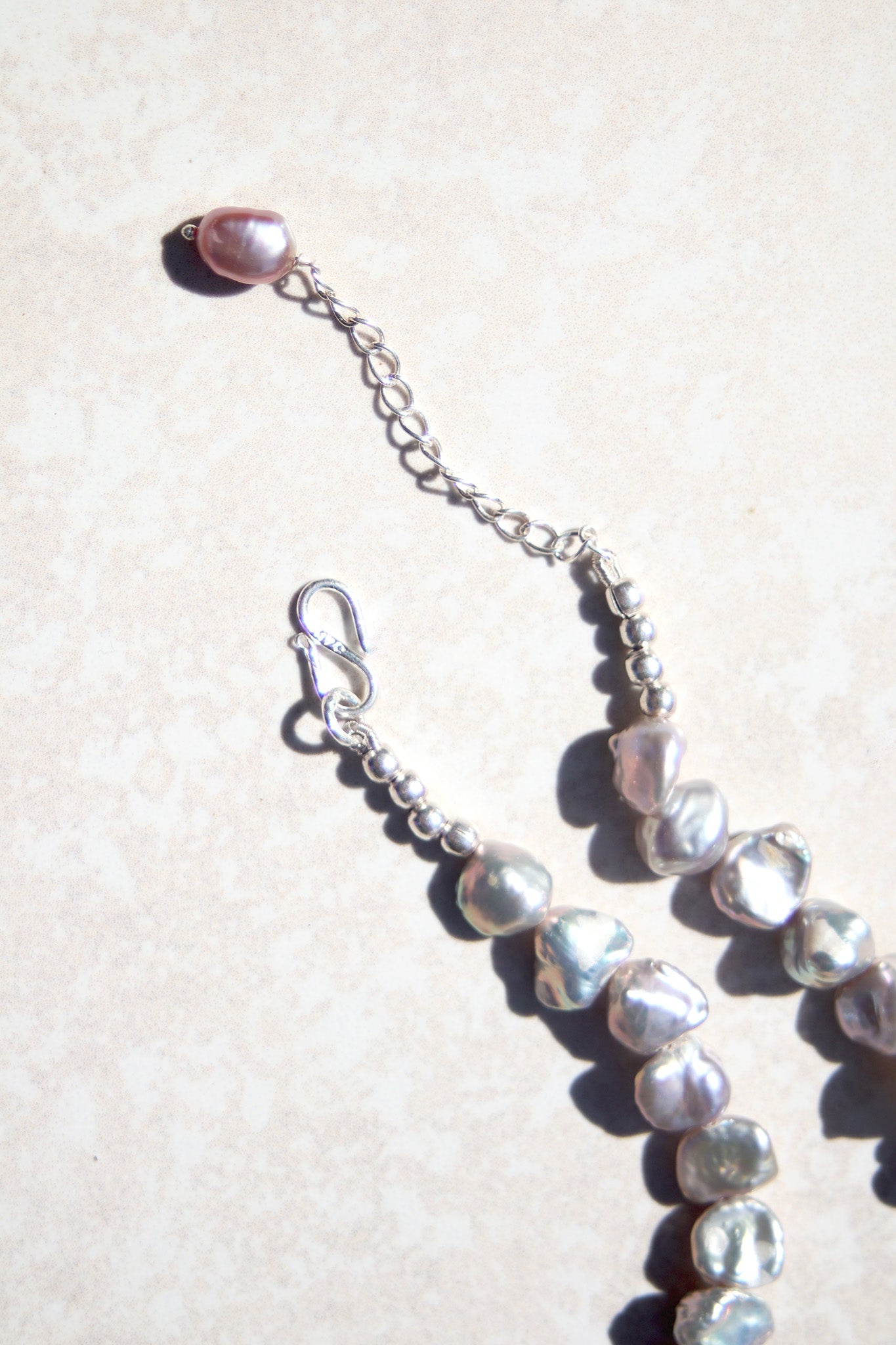 Silver Baroque pearl necklace.