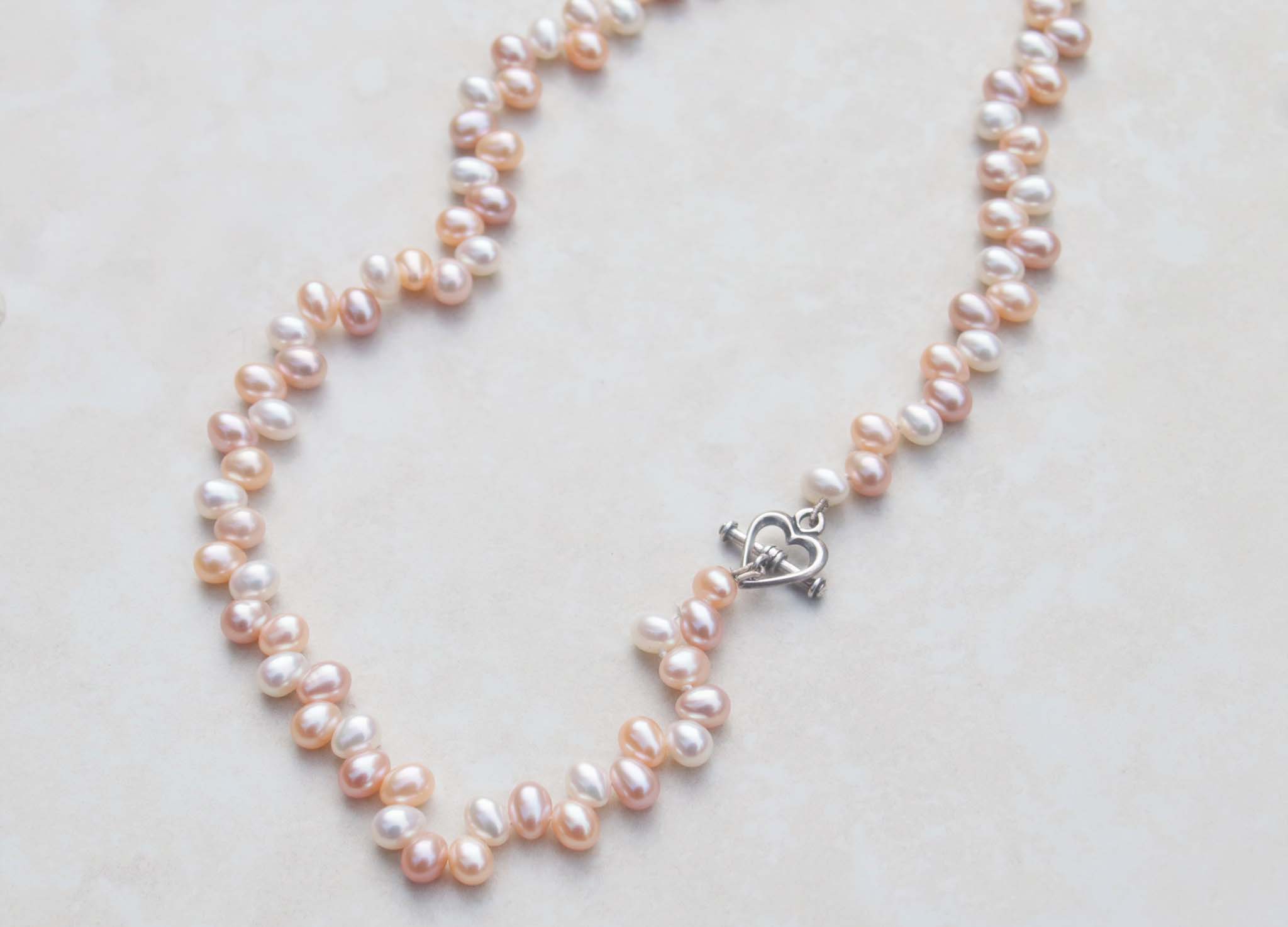 Princess pearl necklace with heart lock