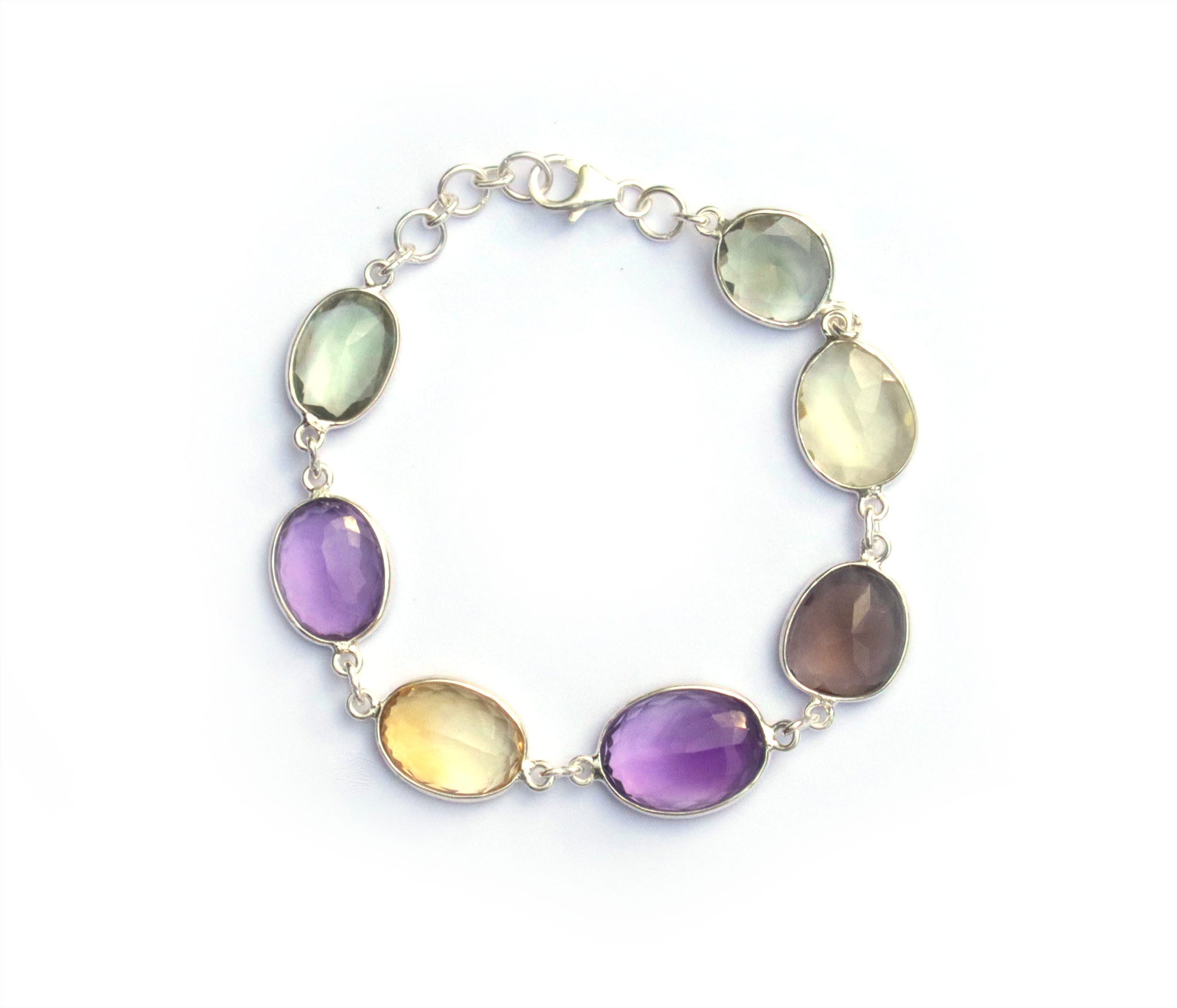 This dainty silver bracelet features a gorgeous mix of Smokey Quartz, Lemon Quartz, Green Amethyst and Amethyst.