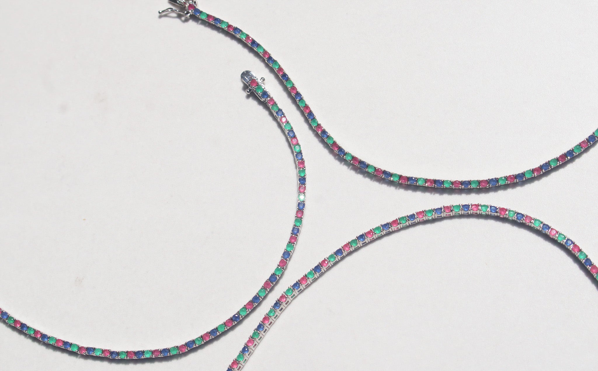 This sterling silver bracelet features a classic arrangement of claw set ruby, emerald and sapphire.This bracelet measures 7.4 inches, with a tongue and groove clasp.