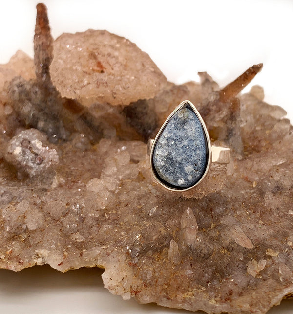A unique natural onyx druzy agate sterling silver ring. Unlike agate, onyx is defined as a banded chalcedony in which the bands are parallel. This gem stands out among others, due to the lustrous colony of crystals formed on its surface known as druzy. This organic pairing forms the ultimate grounding stone, as onyx is said to quill anxiety, calm nervousness. Whilst druzy encourages positive emotions and optimism.
