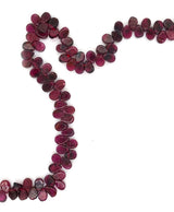 A fancy beaded garnet necklace. This necklace features a string of pear shaped garnet with a sterling silver fastening.  This 16" inch necklace has a 6 cm extension and sterling silver S lock fastening. 